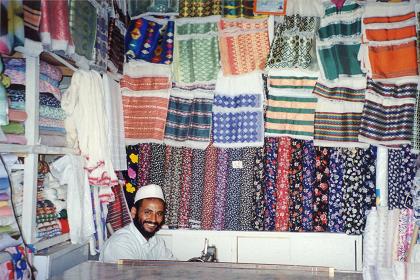 Colorful traditional clothing in a tailors shop in Asmara